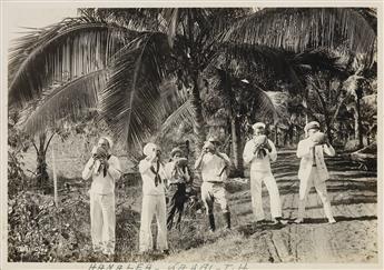 (HAWAII) Album of approx. 110 photos compiled by a U.S. Navy sailor, featuring photographs by official Naval photographer Tai Sing Loo.